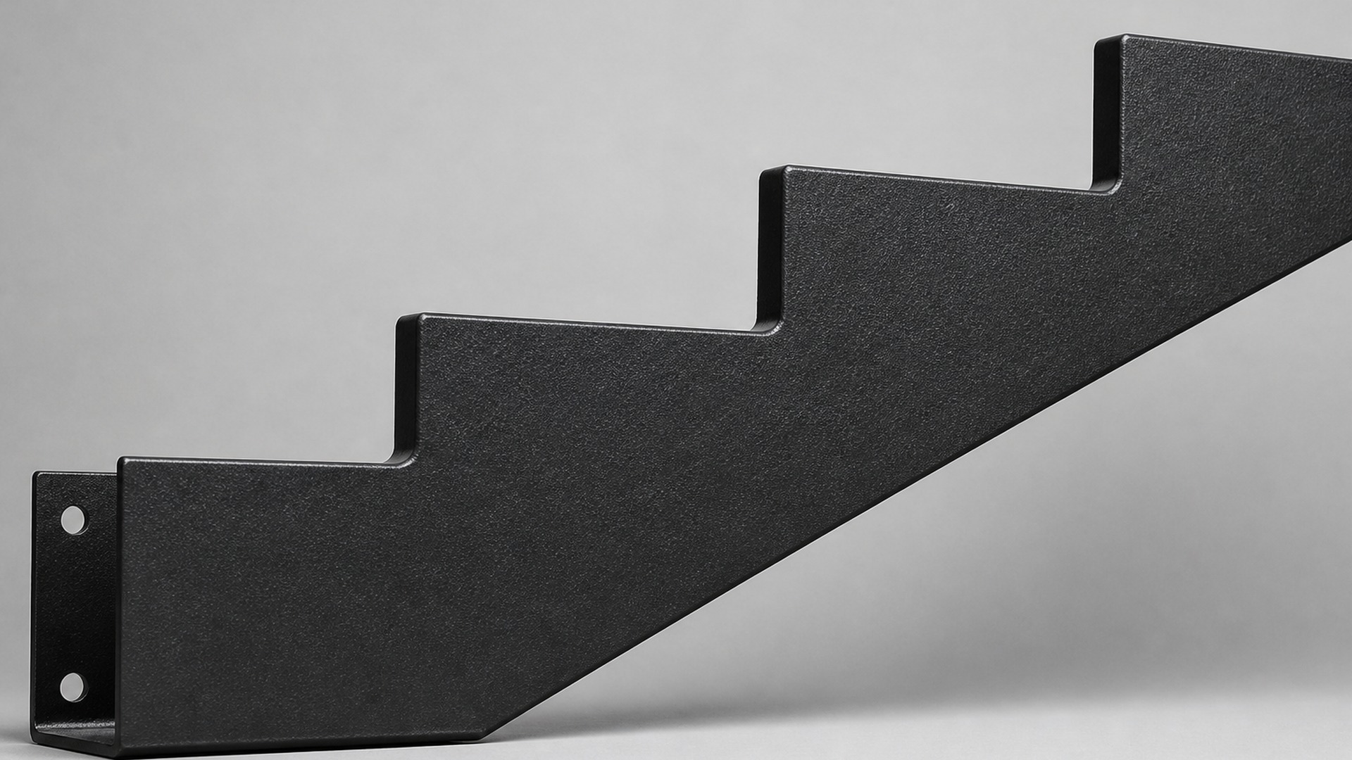 Textured black powder-coated zigzag steel staircase stringer.
